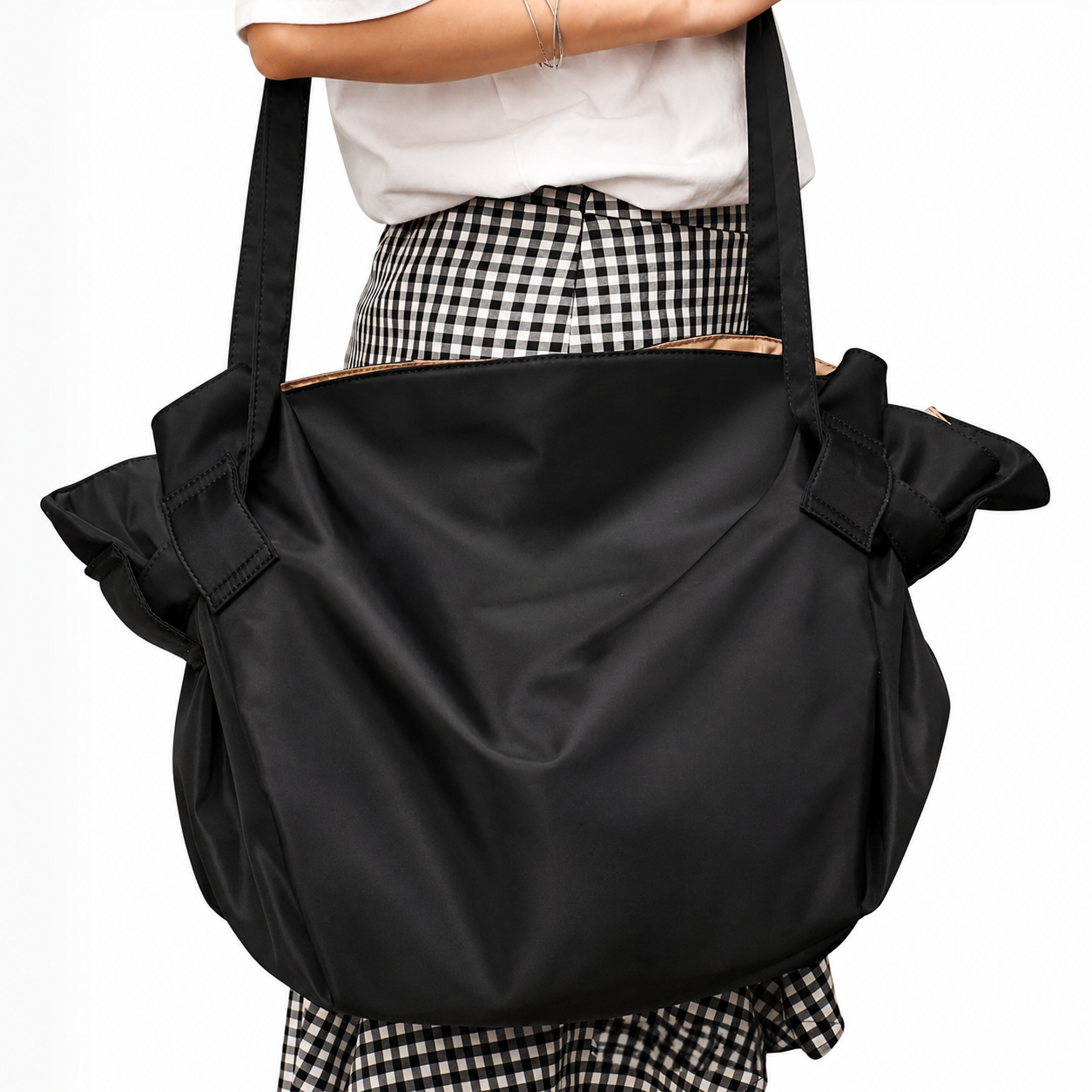 Front view of the closed black convertible tote